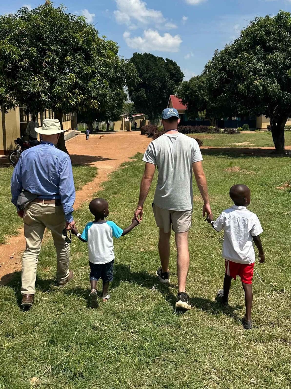 Ministry partners walking together in Uganda